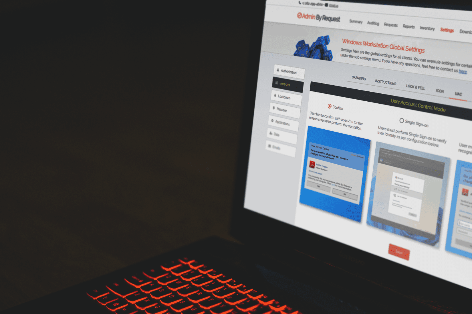 Half a laptop in the dark, with an orange light-up keyboard. » admin by request