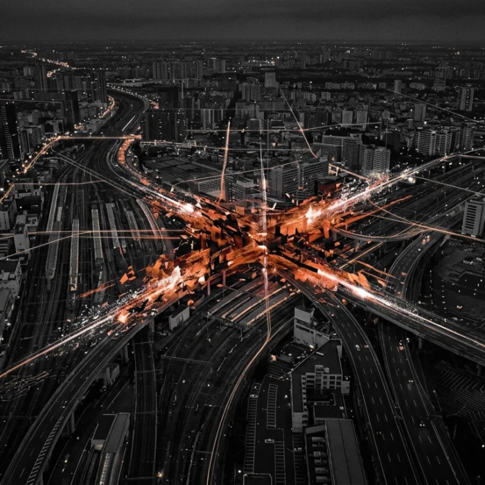 Night aerial of a dense city at dusk with a bright orange highway interchange and glowing data lines converging at the center. » admin by request