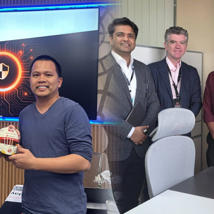 Two men exchange a decorated soccer ball in front of an 'admin by request' presentation screen in a conference room. » admin by request