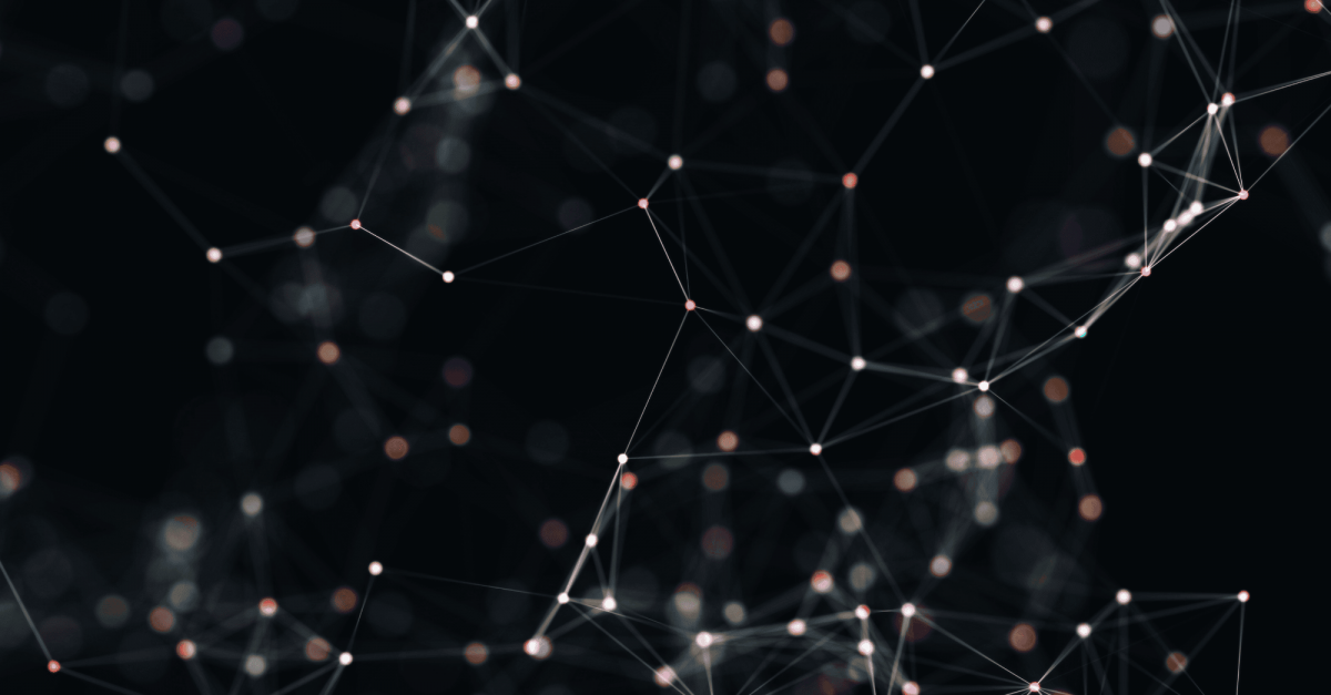 Digital artwork of white dots and lines connected to each other over a blurry background of orange and white dots.