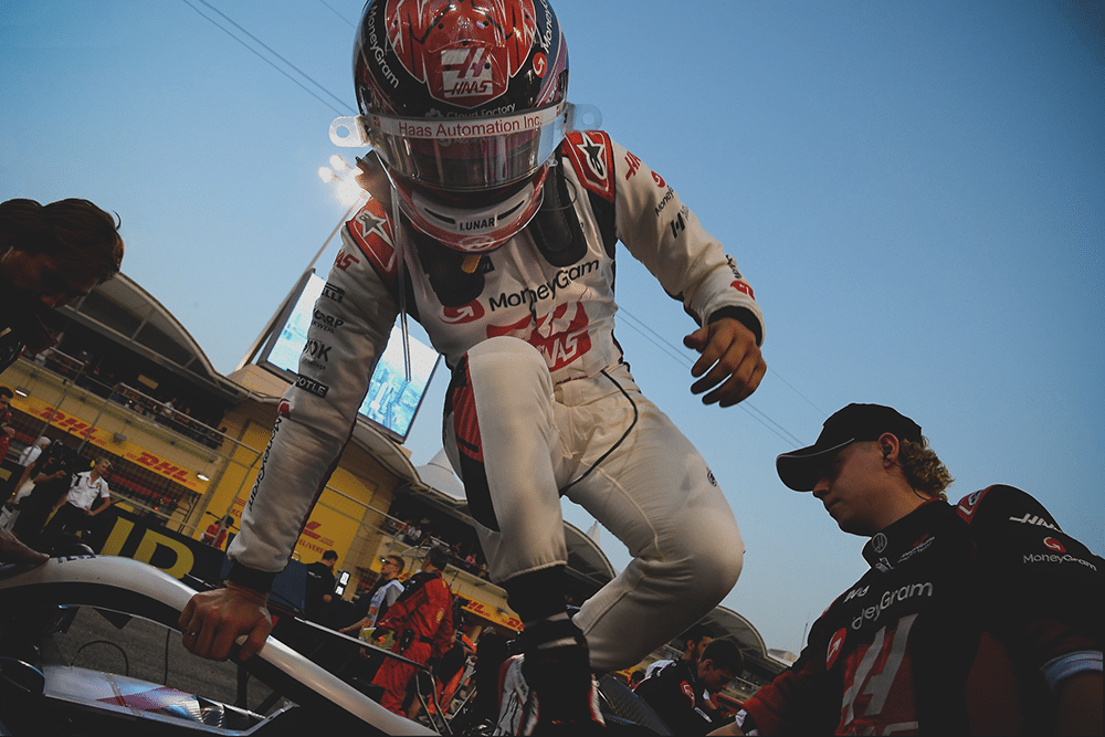 Action-shot of kevin magnussen jumping out of his haas-ferrari f1 car. » admin by request