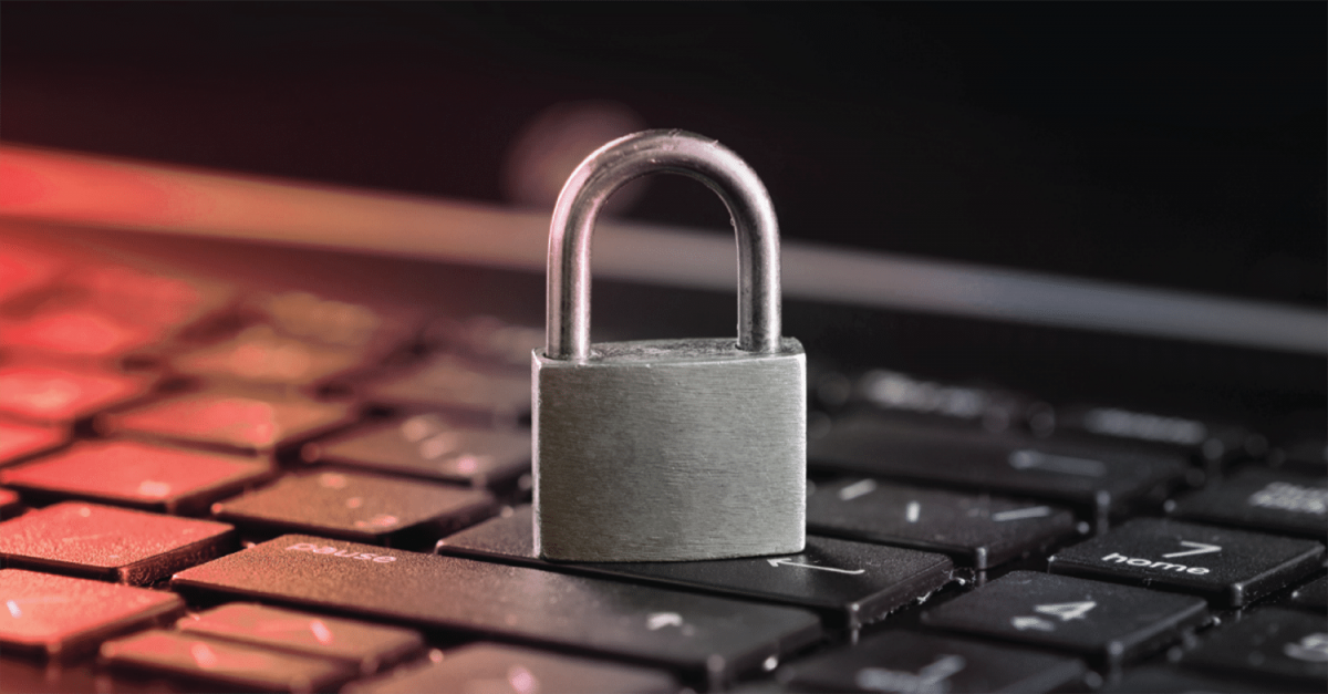 A padlock sitting on top of a black keyboard.