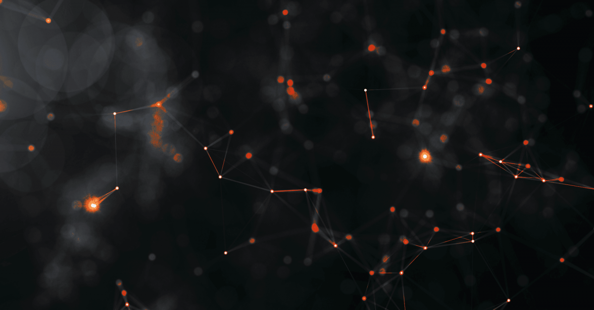 Dark blue and orange background image showing light particles.